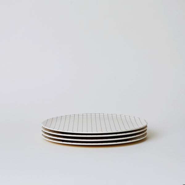 Four Xenia Taler 10" bamboo plates stack together