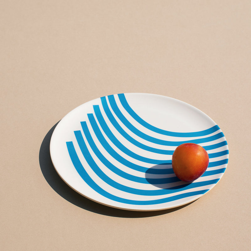A Xenia Taler 8" marina bamboo plate with a tomato on it
