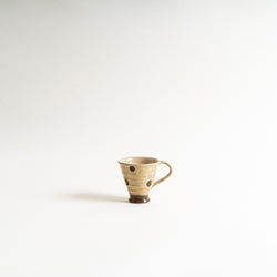 A polka dot design espresso cup
