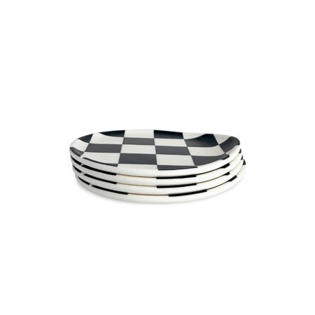 Four Xenia Taler black check coaster stack together