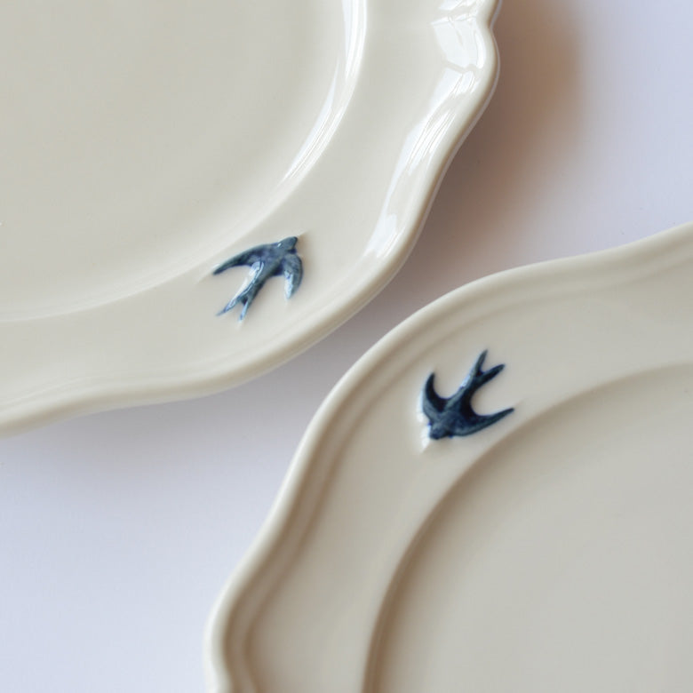 Detail shot of the blue bird on the Studio M' early bird oval plate
