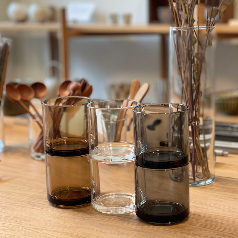 13 oz Hasami Porcelain Glass Tumblers in Amber, Clear, and Gray on a wooden table - Mogutable