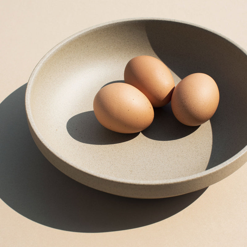 Eggs in a 8.6" Hasami Porcelain Round Bowl in Natural - Mogutable