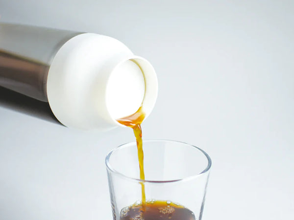 Kinto 1L CAPSULE Cold Brew Carafe with coffee in it.