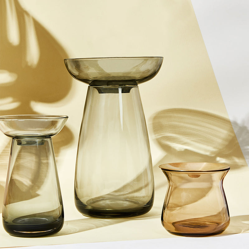 Kinto Aqua Culture Vases in Gray against a white and yellow background